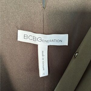 Woman’s BCBG olive green, v-neck, draped, hourglass midi dress.